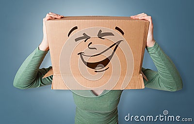 Young girl with happy cardboard box face Stock Photo