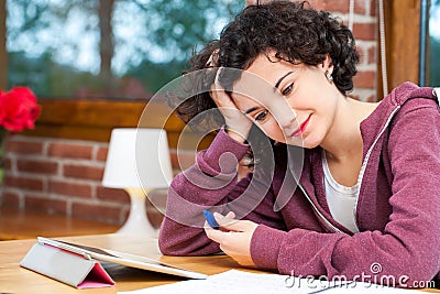 Young girl struggeling with homework. Stock Photo