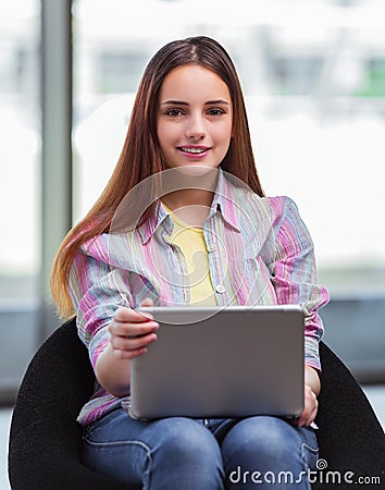 Young girl surfing internet on laptop Stock Photo