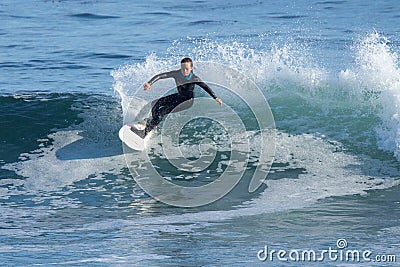 Young Girl Surfing a Wave in California Editorial Stock Photo