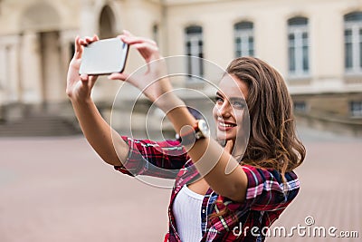 Young girl take selfie from hands with phone on summer city street urban life concept Stock Photo