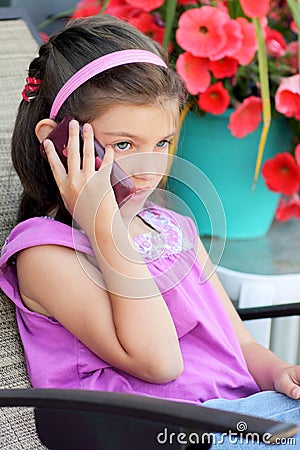 Young girl talking on the cell phone Stock Photo