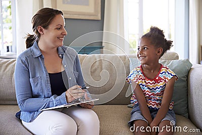 Young Girl Talking With Counselor At Home Stock Photo