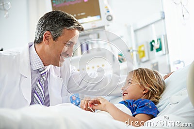 Young Girl Talking To Male Doctor In Intensive Care Unit Stock Photo