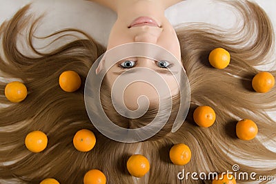 Young girl tangerine orange Stock Photo