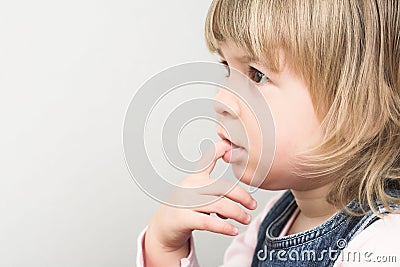 Young girl is thinking Stock Photo