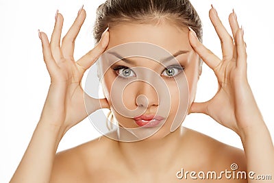 Young girl tightens her face Stock Photo