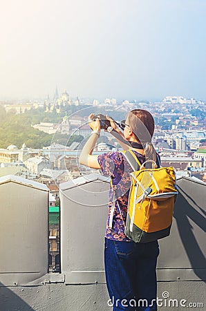 Young Girl Tourist Takes Pictures of Sights Stock Photo