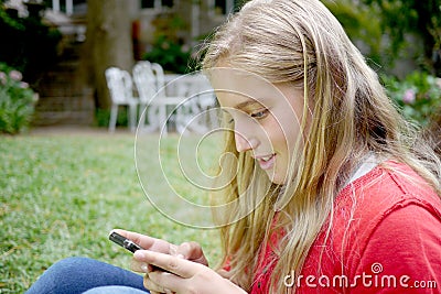 Young girl using a cellphone Stock Photo