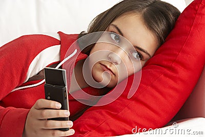Young Girl Waiting For Phone Call Stock Photo