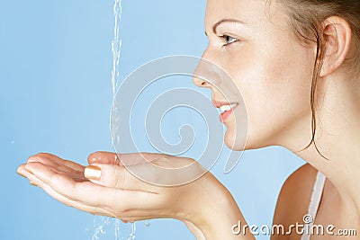 Young girl washes with clean water Stock Photo