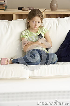 Young Girl Watching Television at Home Stock Photo