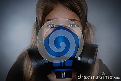 Young girl wearing gasmask, respirator portrait Stock Photo