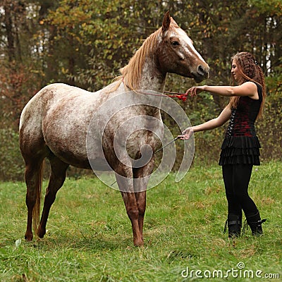 Young girl working with horse, natural horsemanship Stock Photo