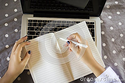 Young girl writes in a diary Stock Photo