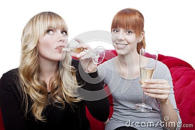 Young girls drink champagne and cheers Stock Photo