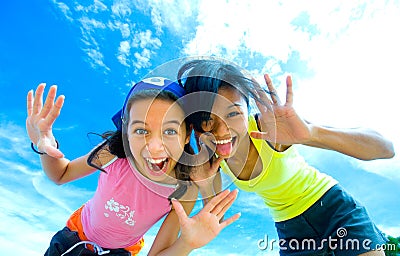 Young girls having fun making funny faces Stock Photo
