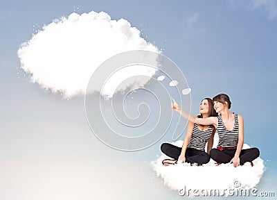 Young girls sitting on cloud and thinking of abstract speech bub Stock Photo