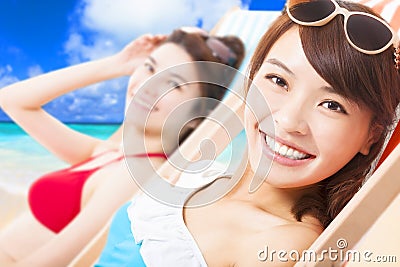 Young girls sunbathing and lying on a beach chair Stock Photo