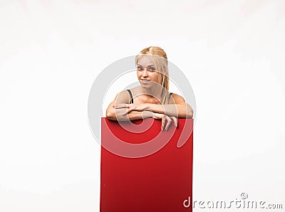 Young glad woman showing presentation, pointing on placard Stock Photo