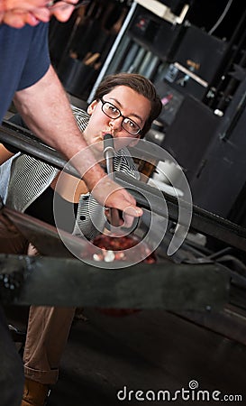 Lady Using Blowpipe for Glass Stock Photo