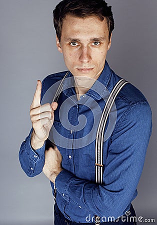 Young goofy man with pimples pointing in studio Stock Photo