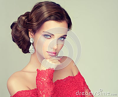 Young, gorgeous model dressed in a red gown. Stock Photo