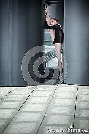 Young graceful ballerina in black bathing suit on Stock Photo