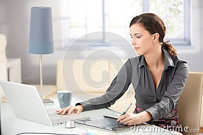 Young graphic designer working at home Stock Photo