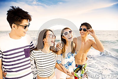 Young group walking on the beach enjoy summer vacation Stock Photo