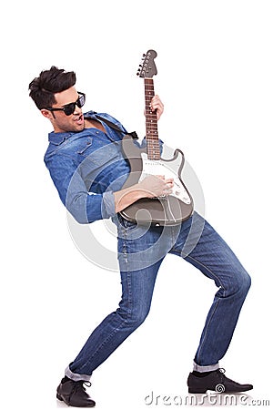 Young guitarist performing Stock Photo