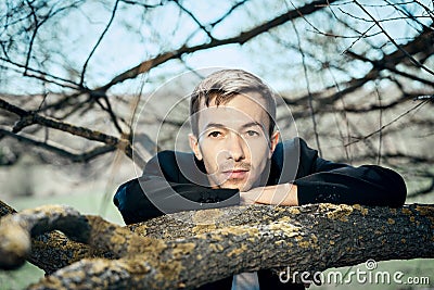 A young guy in a black jacket Stock Photo