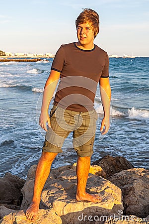 The young guy on Croissette Beach in Cannes Stock Photo