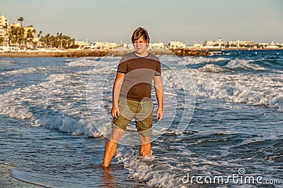 The young guy on Croissette Beach in Cannes Stock Photo