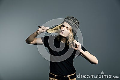 Young guy model posing in a tankman helmet. A portrait of a man Stock Photo