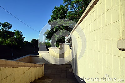 A young guy overcomes obstacles, climbing on concrete walls Stock Photo