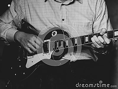 A young guy playing blues on an electric guitar. close-up. Stock Photo