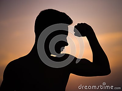 Young guy shows strength Stock Photo