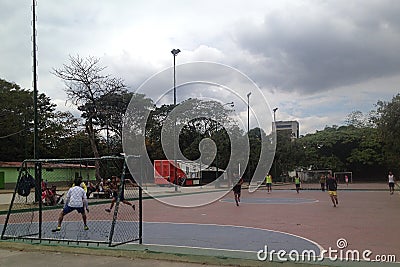 Young guys playing micro soccer in the park Editorial Stock Photo