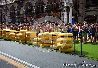 Young guys waiting for playing with the longest water slide entered in the Guinness Book of Records showed for the Costa Cruises F Editorial Stock Photo