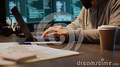 Young hacker breaking into database server on computer Stock Photo