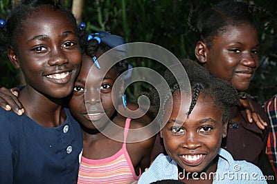 Young Haitian girls pose for camera in rural village. Editorial Stock Photo