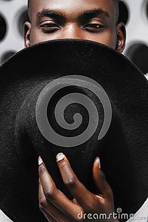 Young handsome afro american boy in stylish hipster hat Stock Photo