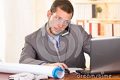 Young handsome architect working in an office Stock Photo