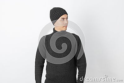 Young handsome asian man wearing grey sweater and beanie thinking an idea while looking up on white background. Stock Photo