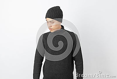 Young handsome asian man wearing grey sweater and beanie thinking an idea while looking up on white background. Stock Photo