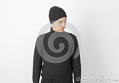 Young handsome asian man wearing grey sweater and beanie thinking an idea Stock Photo