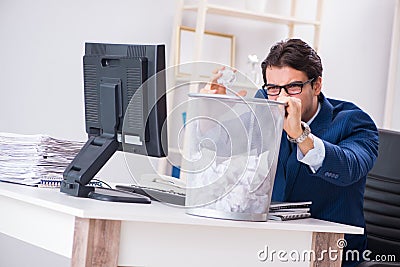 Young handsome businessman employee working in office in paperwo Stock Photo