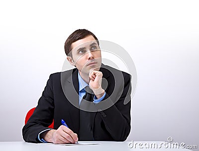 Young handsome businessman writing a letter Stock Photo