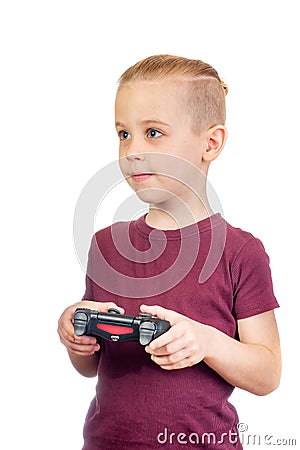 Young handsome caucasian boy plays computer games with joystick Stock Photo